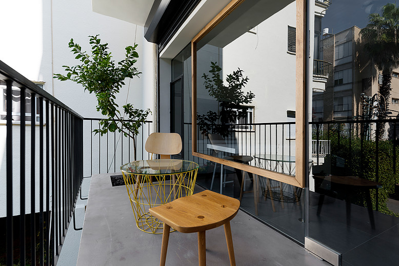 balcony with a planted lemon tree