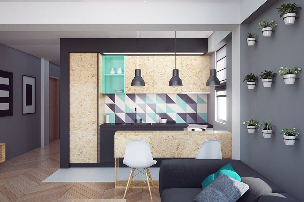 Vista frontale di una cucina lineare in osb in un piccolo appartamento, con basi laccate nere come la parete di fondo e con paraschizzi a decoro triangolare.